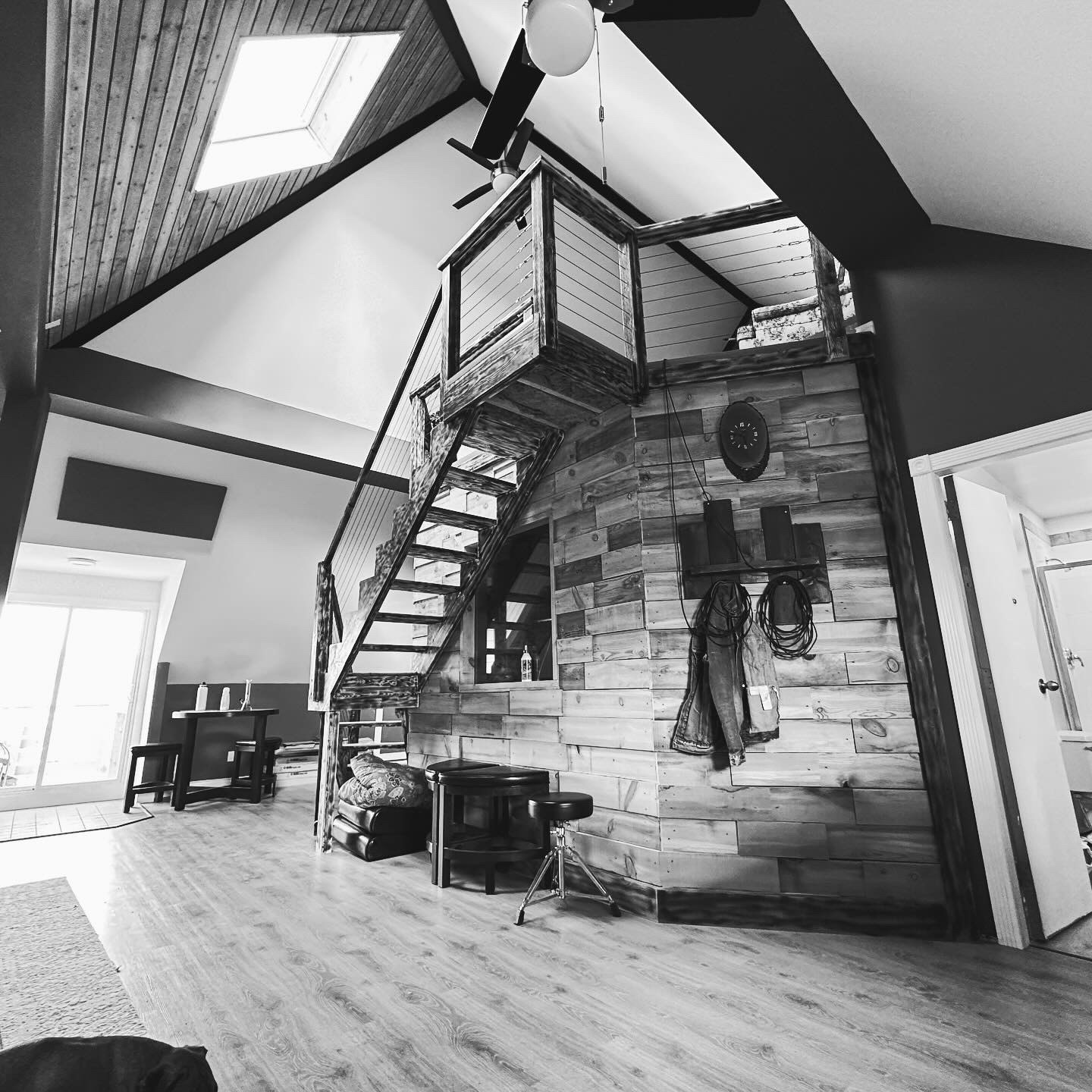 A-frame studio interior with custom staircase