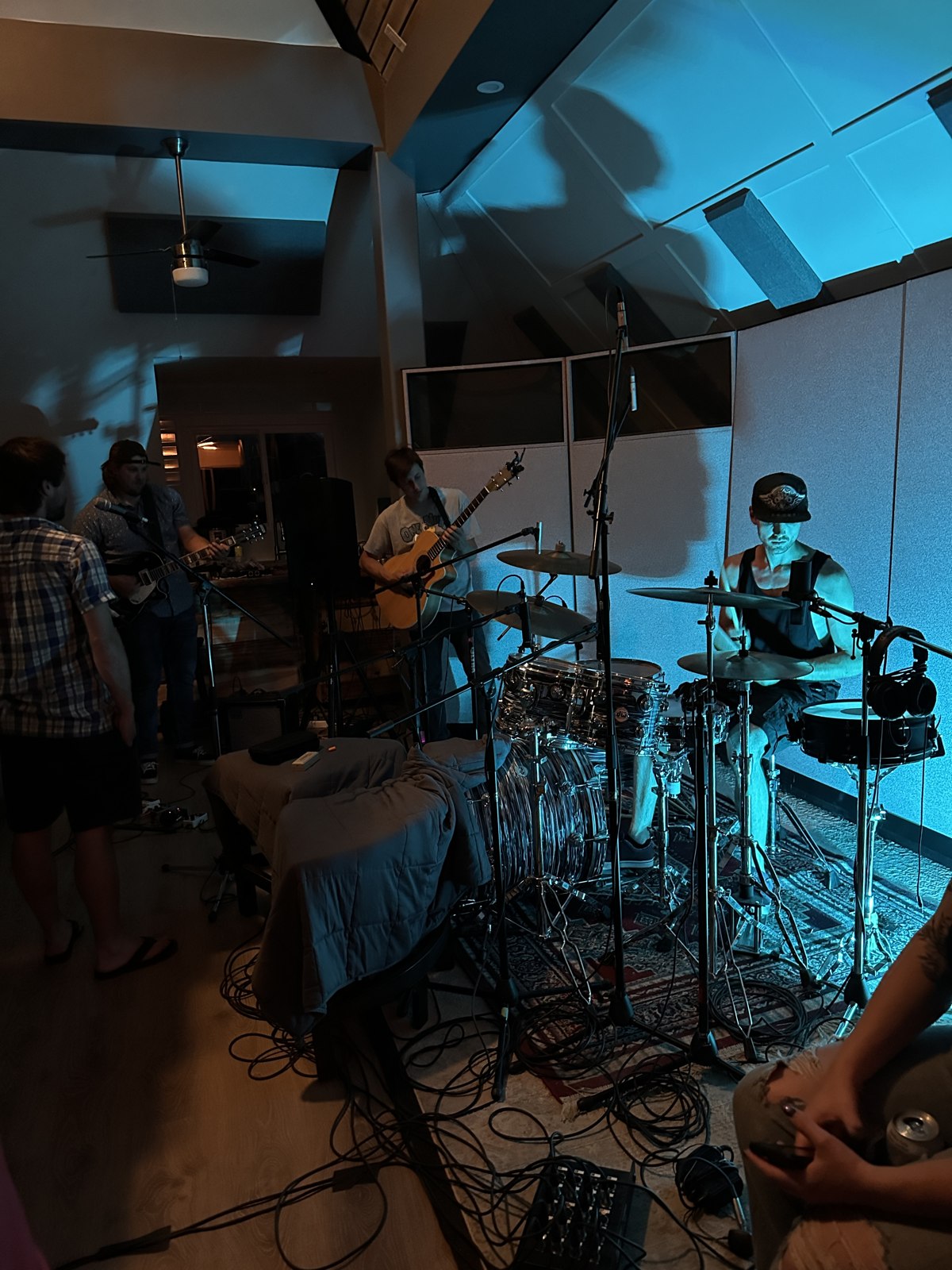 Live band session with blue stage lighting